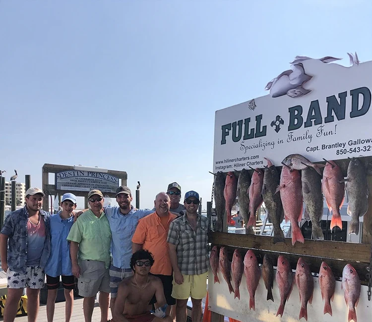 Happy expedition showing captured fish with HiLiner.