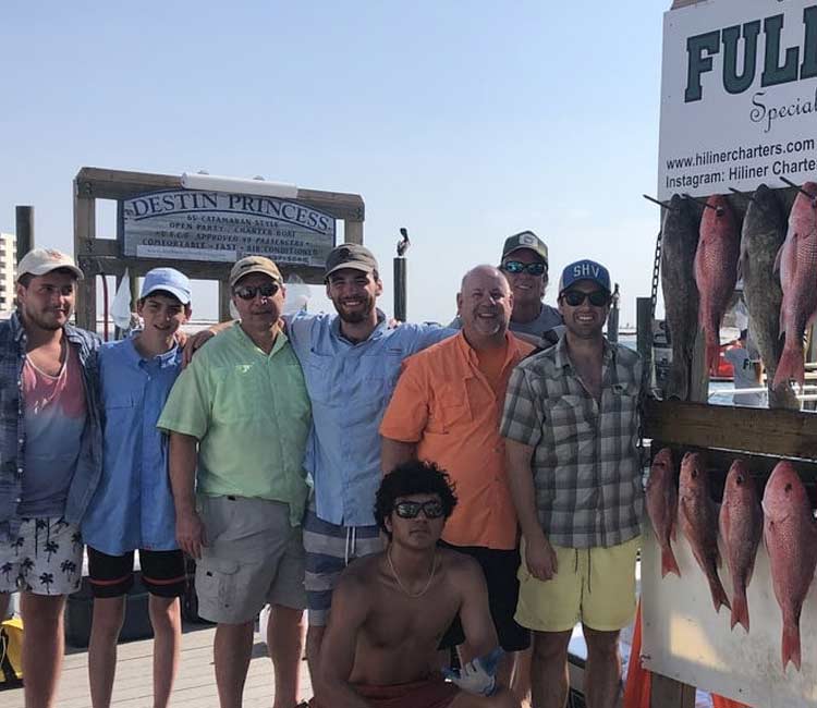 Happy expedition showing captured fish with HiLiner.